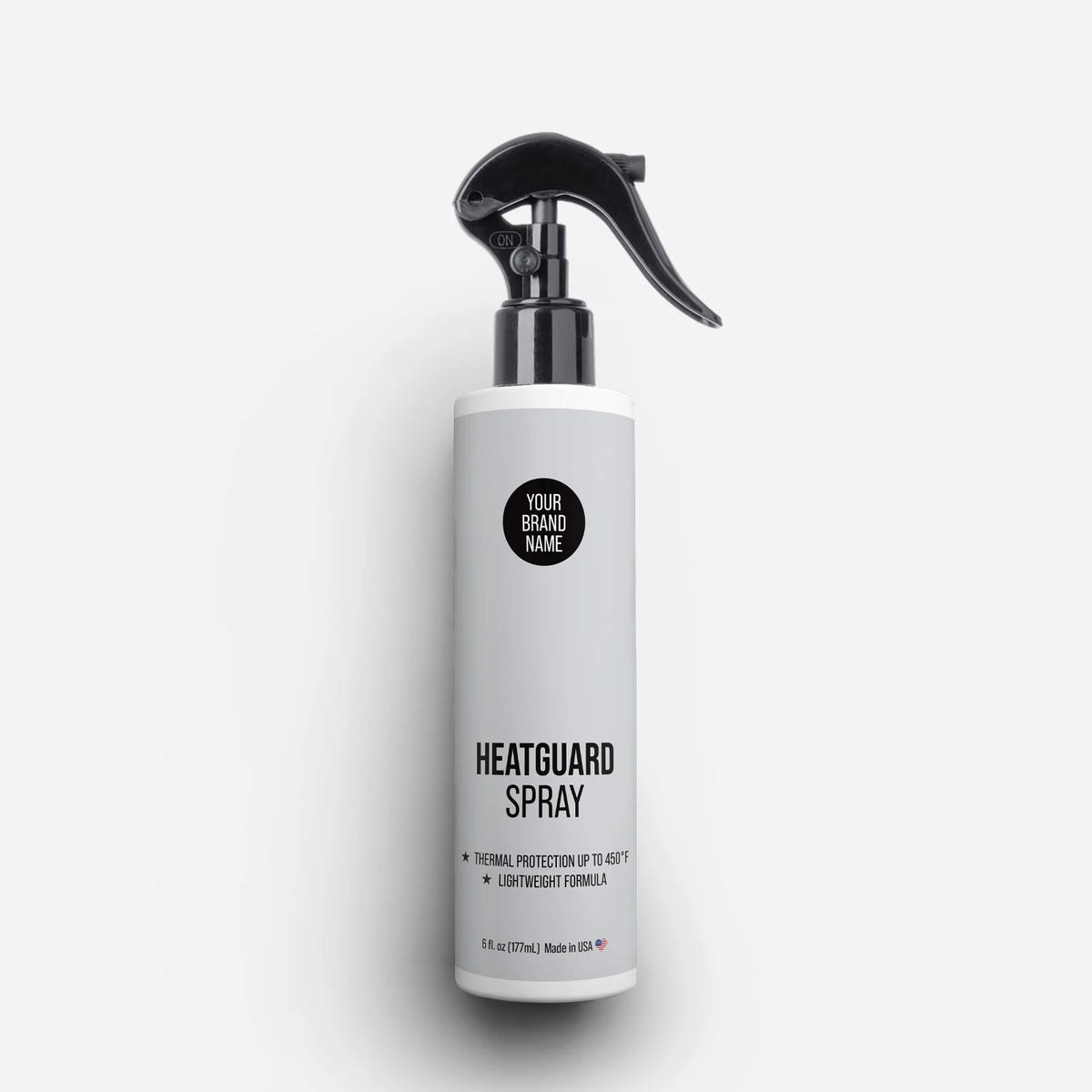 Private Label Heatguard Spray featuring thermal protection up to 450°F and lightweight formula in a 5 oz trigger spray bottle, made in USA.
