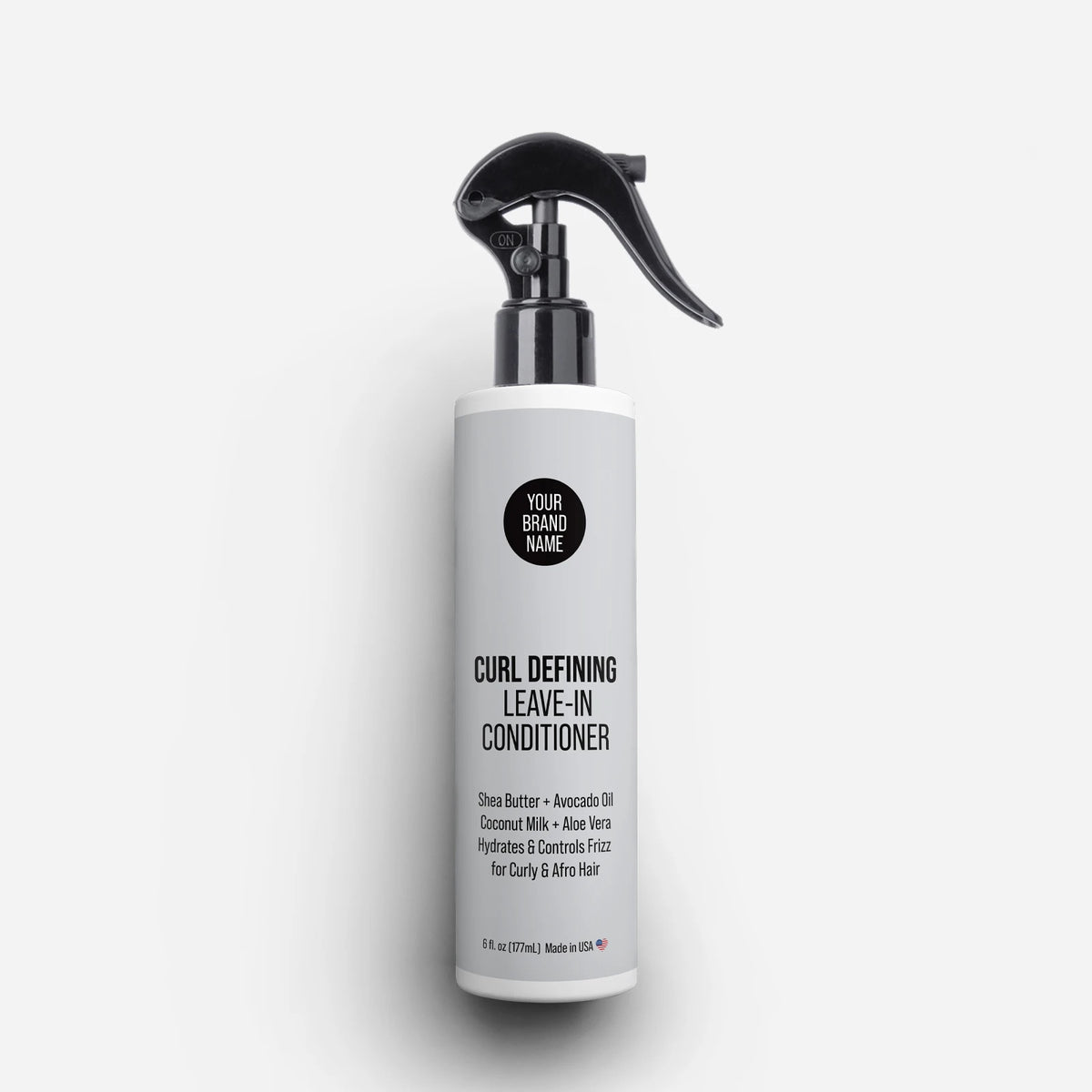 Private Label Curl Defining Leave-In Conditioner featuring Shea Butter, Avocado Oil, Coconut Milk, and Aloe Vera, providing hydration and frizz control for curly and afro hair in a trigger spray bottle, made in USA