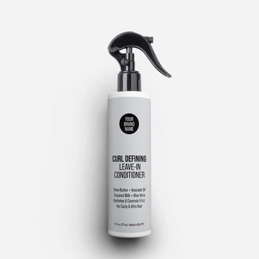 Private Label Curl Defining Leave-In Conditioner featuring Shea Butter, Avocado Oil, Coconut Milk, and Aloe Vera, providing hydration and frizz control for curly and afro hair in a trigger spray bottle, made in USA