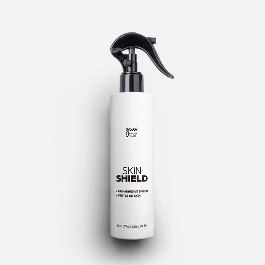 Private Label Skin Shield Spray featuring a protective barrier for secure adhesion and gentle formula in a 6 oz (177 mL) trigger spray bottle, professional wig and hair replacement preparation, made in USA