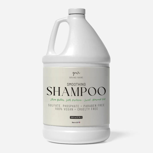 Smoothing Shampoo featuring Shea Butter, Silk Proteins, and Sweet Almond Oil in a 1 gallon (128 fl oz / 3.78 L) bulk jug, sulfate-free, phosphate-free, paraben-free, 100% vegan, and cruelty-free, made in USA.